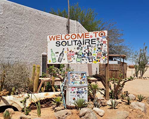 Discover Solitaire, a remote desert outpost in Namibia known for its rustic charm, scenic landscapes, fresh apple pie, and gateway to Namib-Naukluft Park.