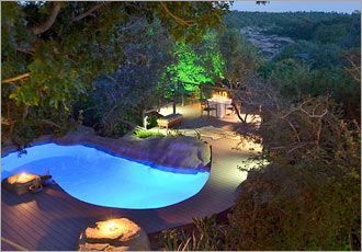 Beautifully lit, refreshing swimming pool to cool down in