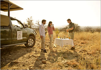 Sundowner on a game drive at Morokolo Game Lodge