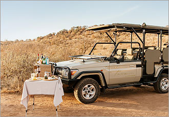 Enjoy sundowners while on a game drive